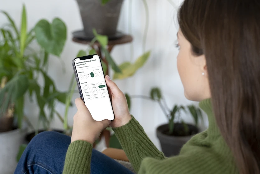 Woman Searching Something Internet Using Her Smartphone While Being Home (2)