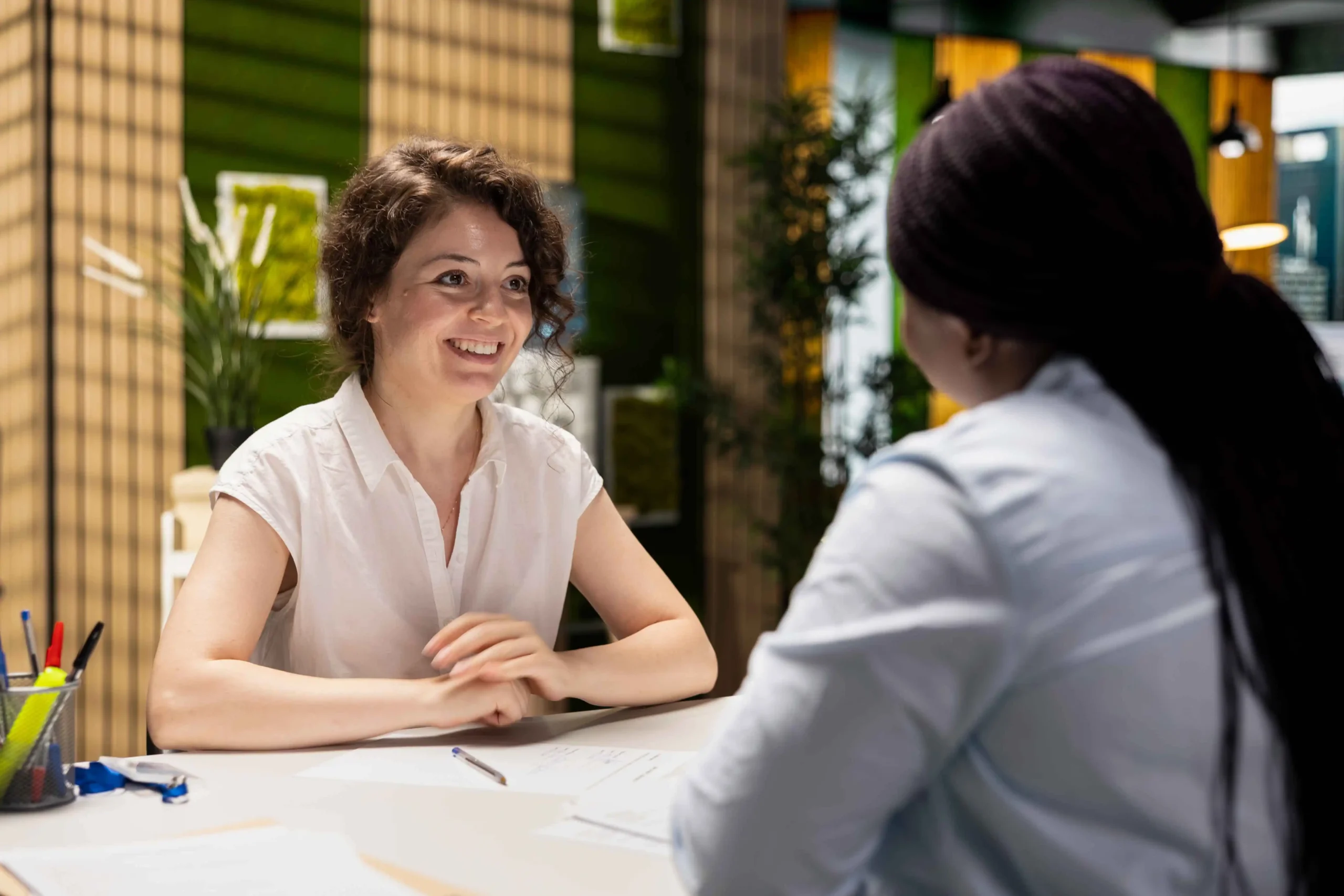 Confident Woman Signing Contract With Human Resources Assistant Joining Organizations After